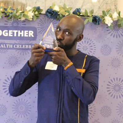 Jacob Otile, M.D. with his award