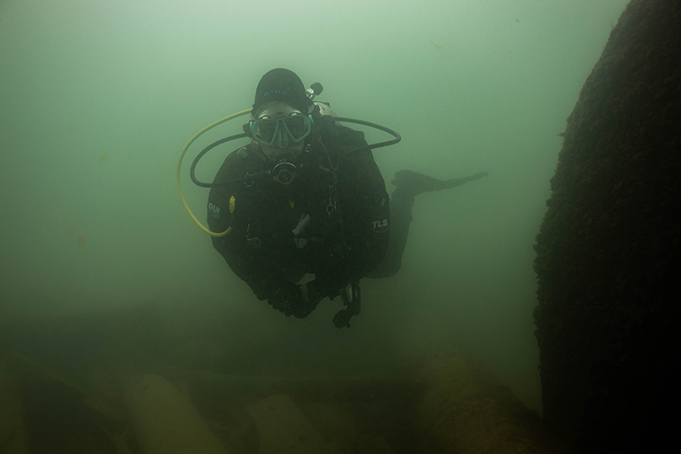 IU researcher Rachel Wilson swims around one of the boilers of the Muskegon, a historic shipwreck in Lake Michigan.